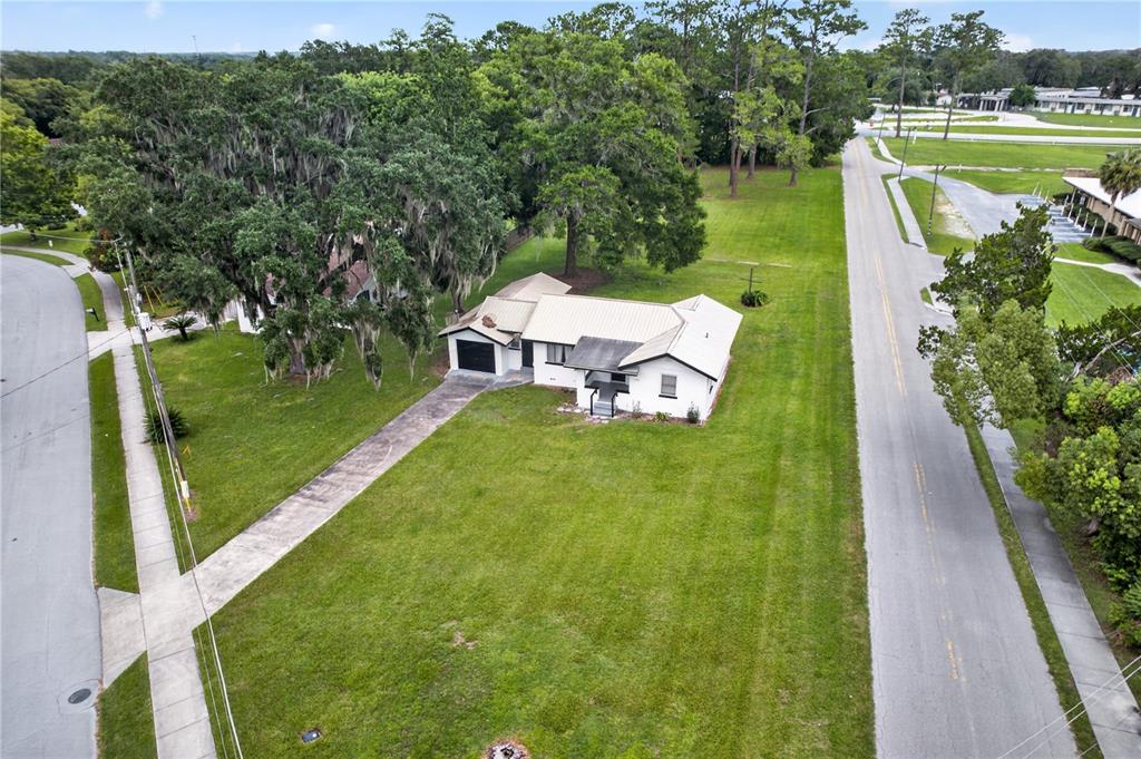 5514 Southeast Hames Road Belleview, FL 34420 - Photo 39 of 44 a view of a lake with a yard