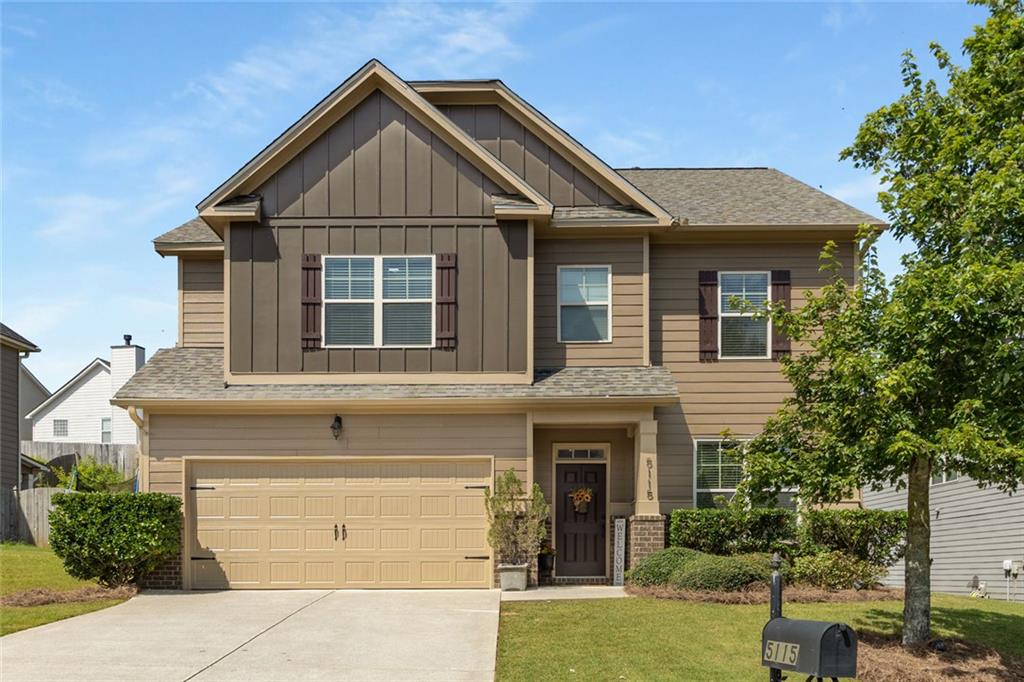 5115 Rialto Way Cumming, GA 30040 - Photo 1 of 1 a front view of a house with a yard