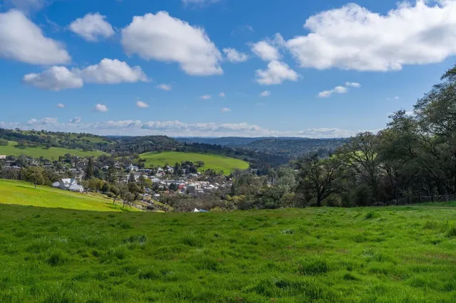 a view of a golf course with green space