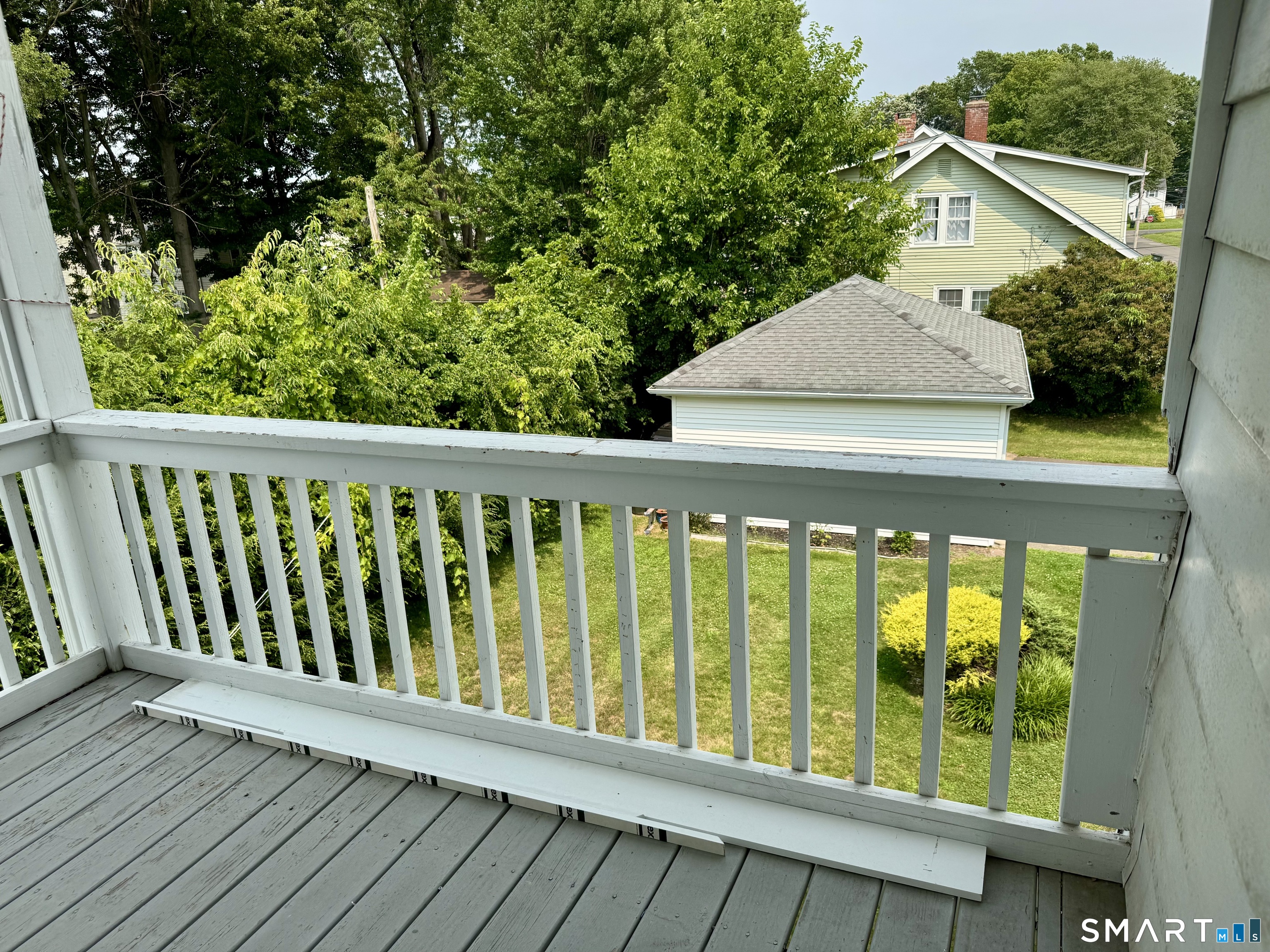 144 Wolcott Hill Road Wethersfield, CT 06109 - Photo 3 of 17 view from deck of yard and garage