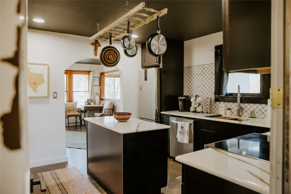 a kitchen with a sink and cabinets
