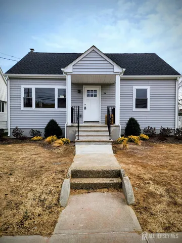 a front view of a house with swimming pool