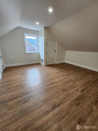 a view of empty room with wooden ceiling