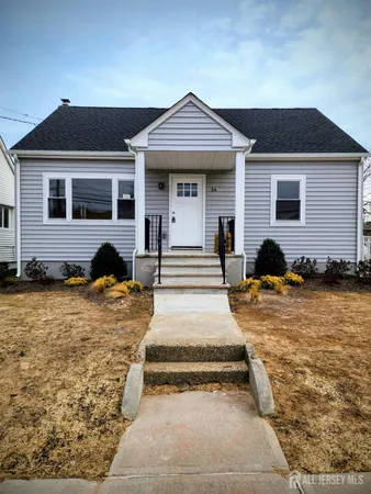 a house that has a large tree in front of it
