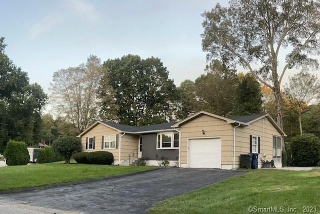 2 South St Extension Windham, CT 06226 - Photo 1 of 1 a view of a yard in front of a house with large trees