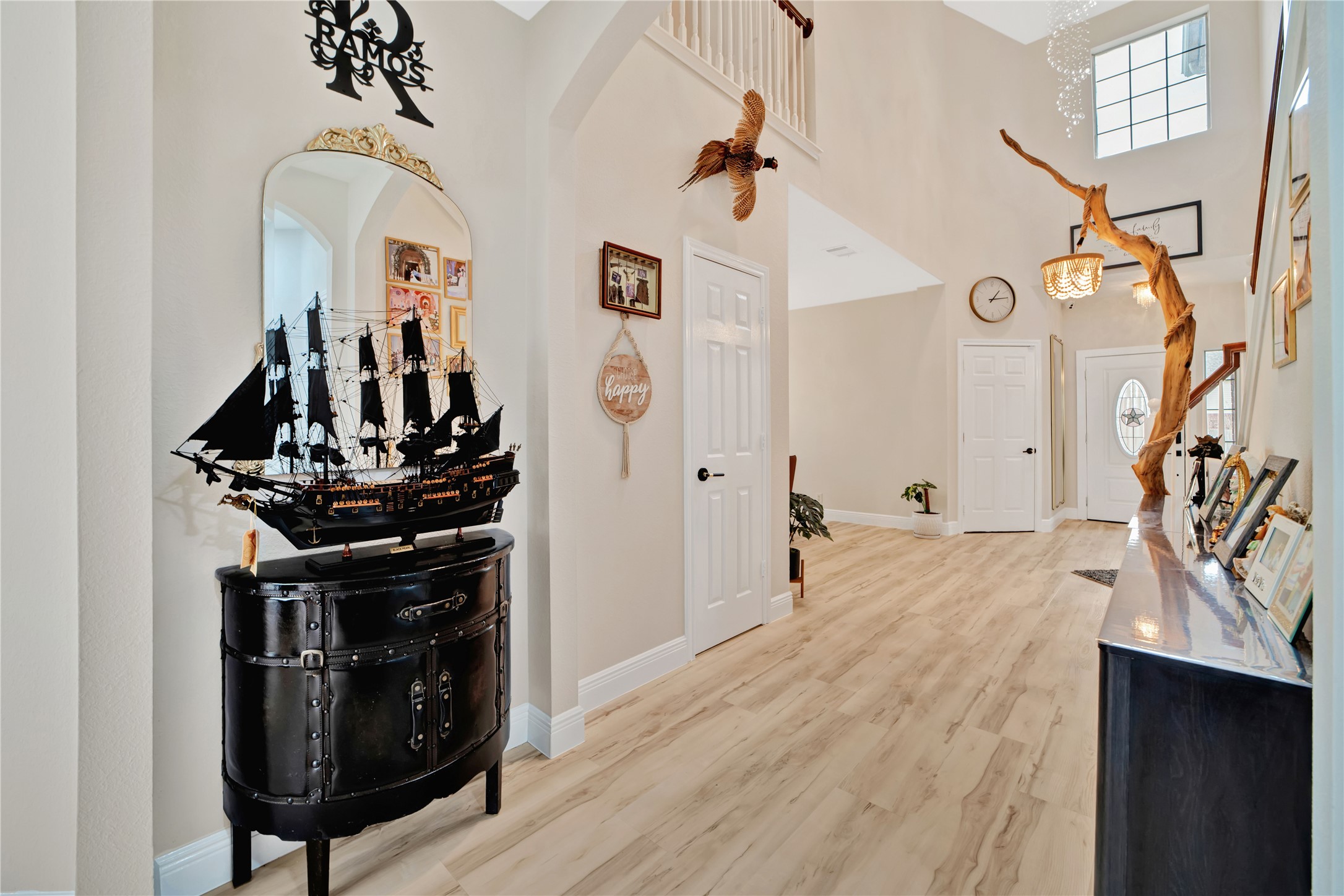 3032 Prairie Bluff Seguin, TX 78155 - Photo 5 of 23 Foyer featuring light wood finished floors, a high ceiling, and arched walkways