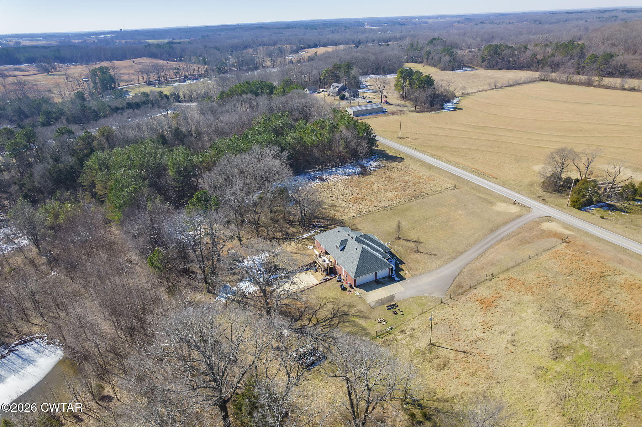 4320 Timberlake-Wildersville Road Lexington, TN 38351 - Photo 39 of 58 a view of a dry yard with mountain and trees