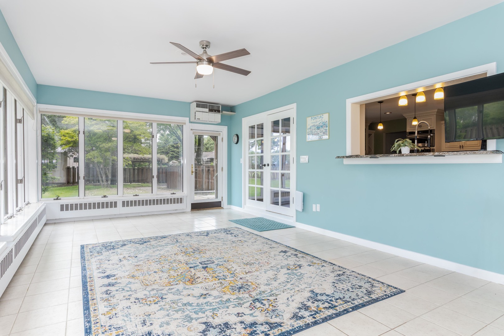 1810 Cardinal Court Pontiac, IL 61764 - Photo 24 of 88 a view of a livingroom with wooden floor and a ceiling fan