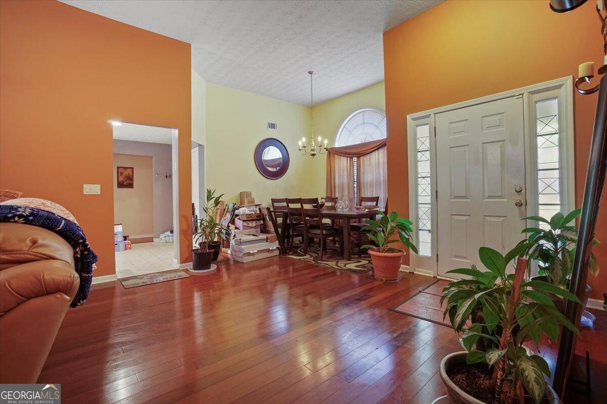 915 Harbins View Drive Dacula, GA 30019 - Photo 11 of 26 a living room with furniture and a large window