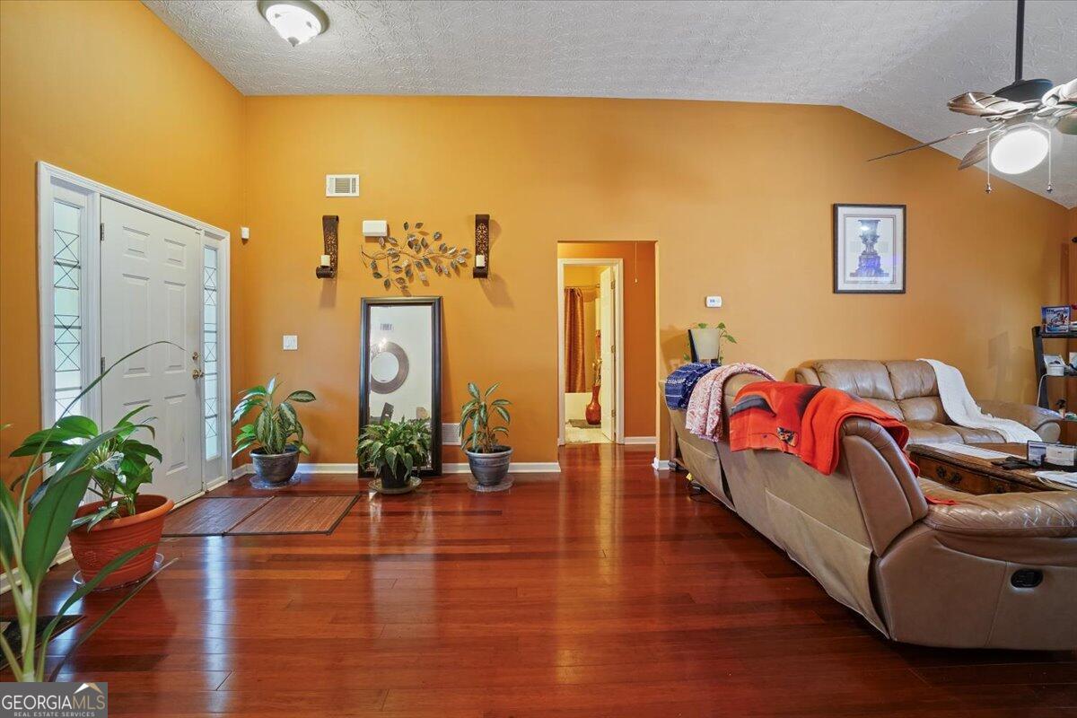 915 Harbins View Drive Dacula, GA 30019 - Photo 8 of 26 a living room with furniture