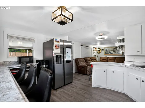 a view of kitchen with furniture and a window