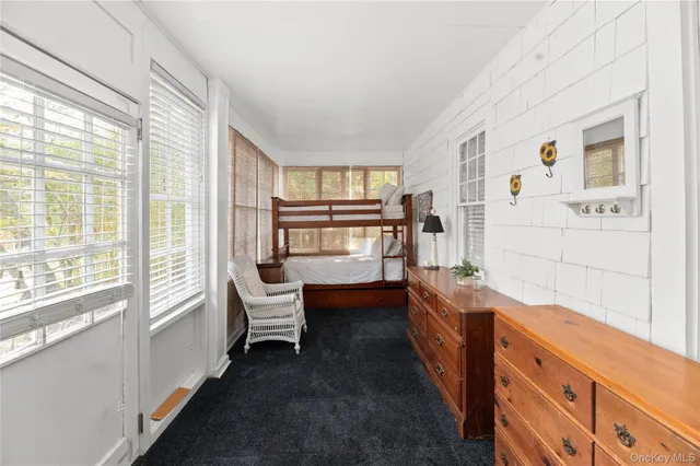 a bathroom with a bathtub sink and mirror