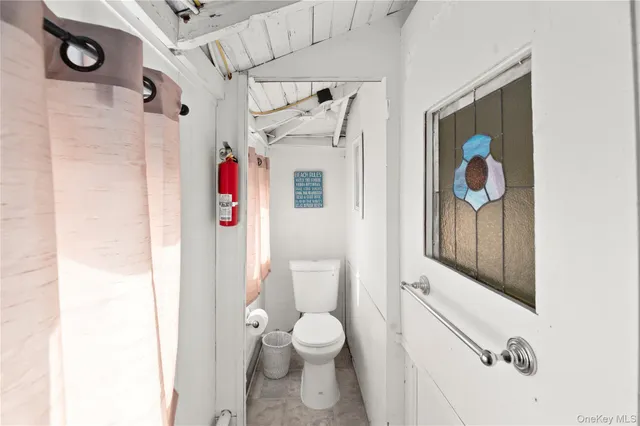 a view of a patio with table and chairs and potted plants