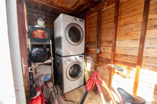 a view of entryway with a front door and wooden floor