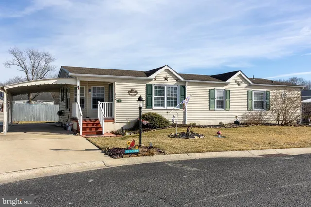 a front view of a house with swimming pool and porch