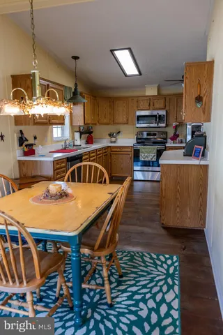 a dinning table and chairs in a room