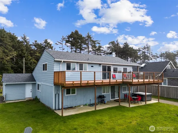 a view of a house with a backyard porch and sitting area