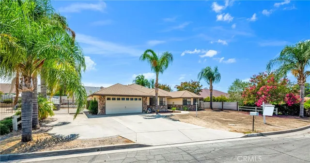 a view of a house with a garden and pathway