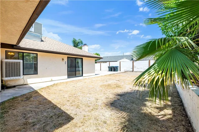 a front view of a house with a garden and entryway