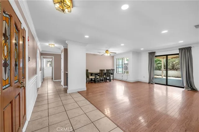 a view of a entryway with furniture and a chandelier