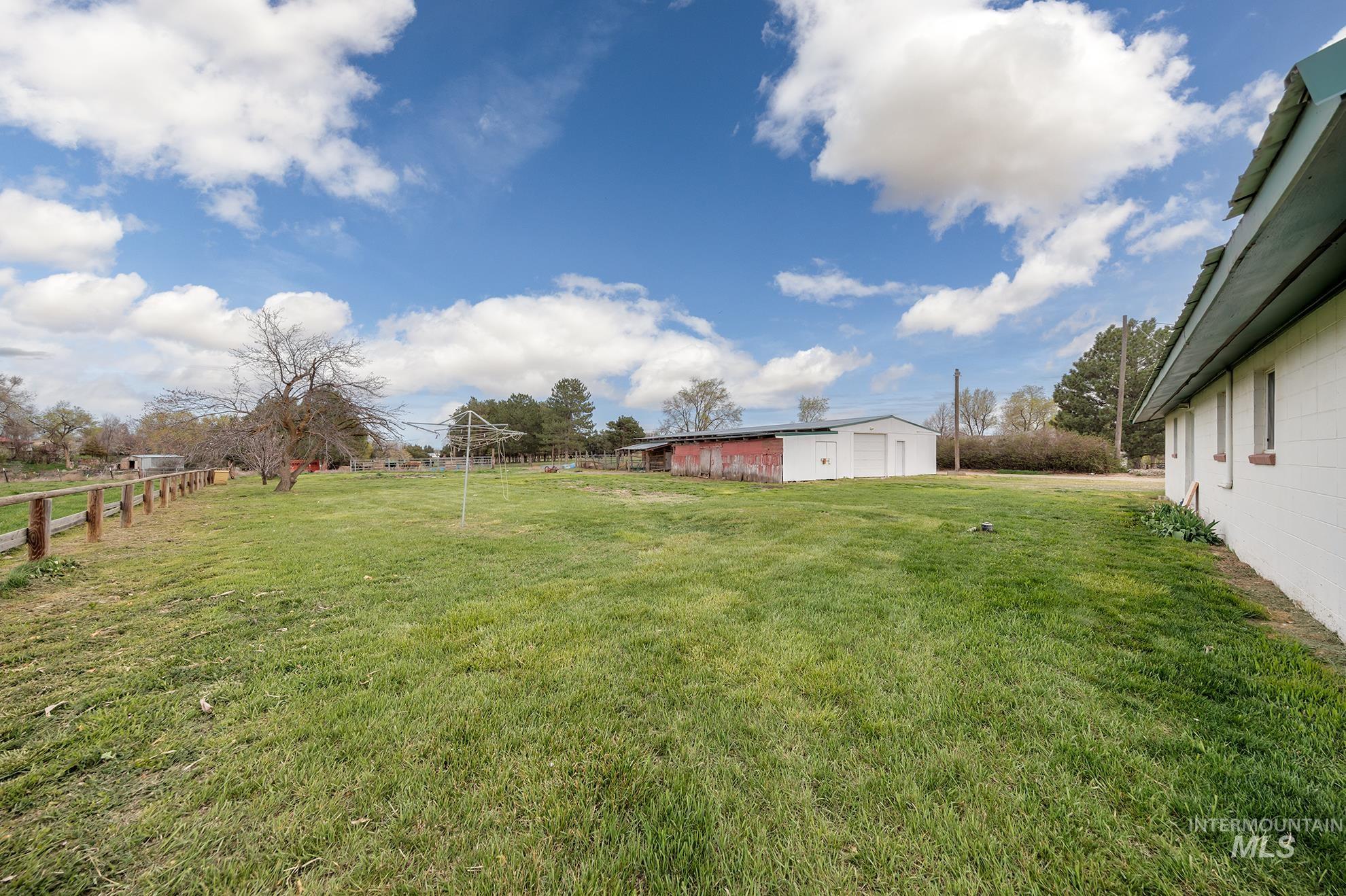 4484 Community Road Ontario, OR 97914 - Photo 27 of 35 View of yard featuring an outdoor structure and a garage