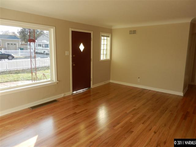 1275 Charles Drive Reno, NV 89509 - Photo 2 of 13 a view of an empty room with wooden floor and a window