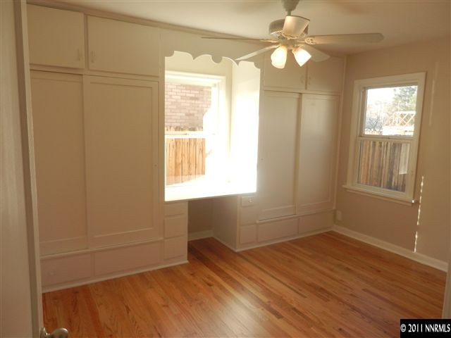 1275 Charles Drive Reno, NV 89509 - Photo 9 of 13 a view of an empty room with wooden floor and a window
