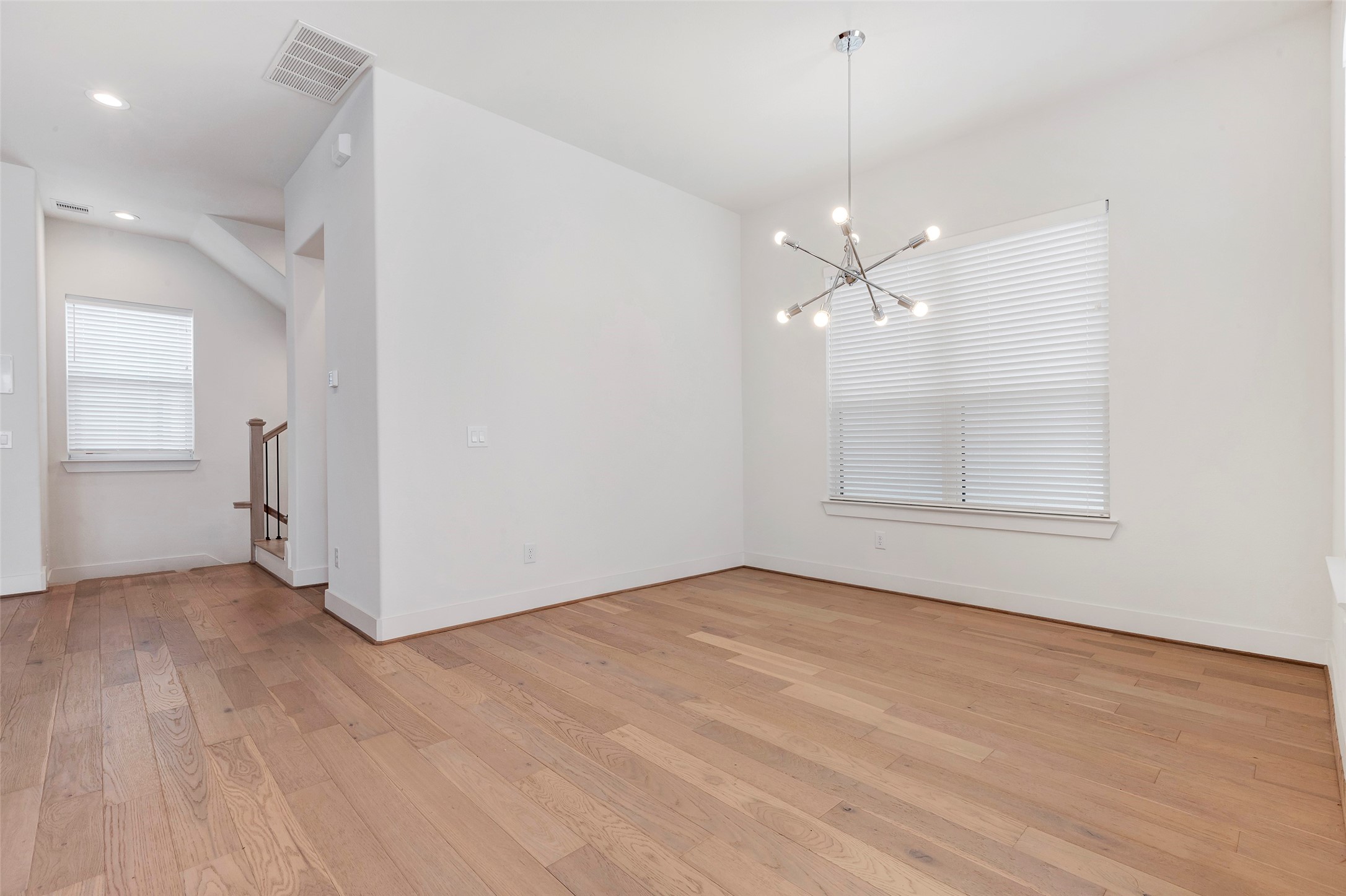 1740 Ojeman Point Lane Houston, TX 77055 - Photo 12 of 20 wooden floor in an empty room with a window