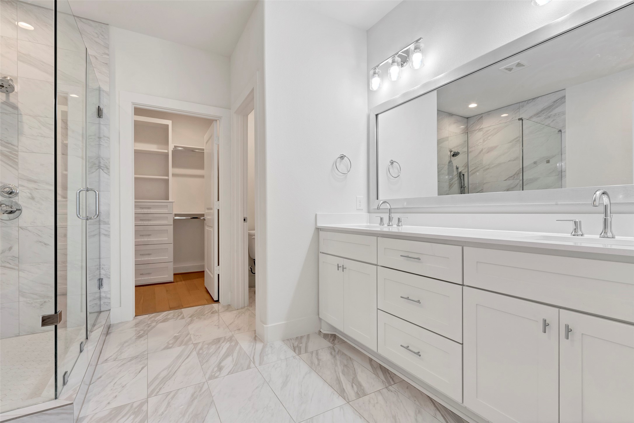 1740 Ojeman Point Lane Houston, TX 77055 - Photo 16 of 20 a spacious bathroom with a shower sink and mirror