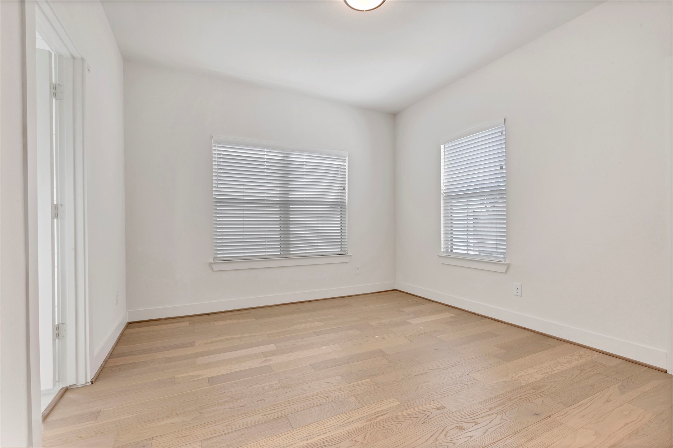 1740 Ojeman Point Lane Houston, TX 77055 - Photo 18 of 20 an empty room with windows