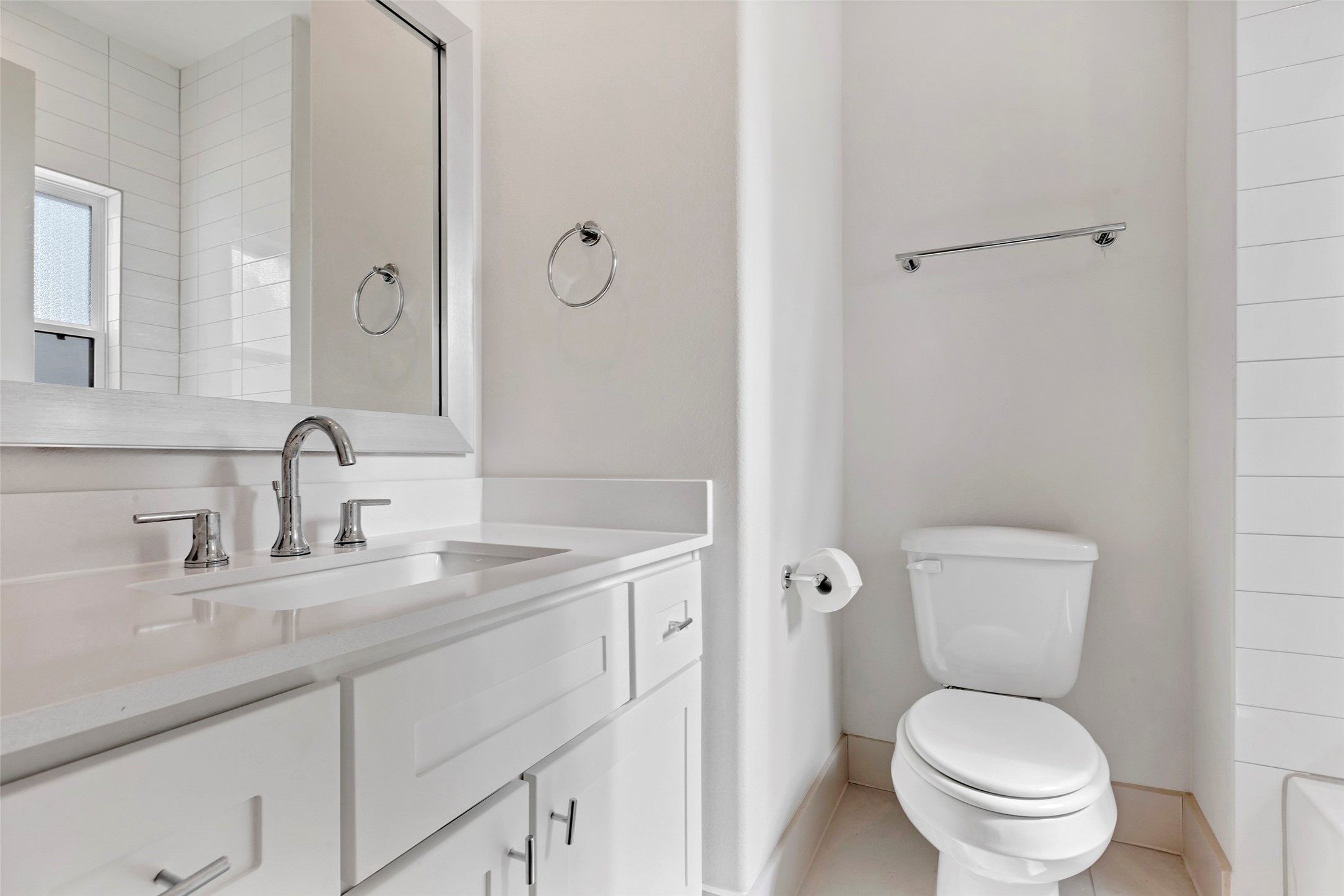 1740 Ojeman Point Lane Houston, TX 77055 - Photo 19 of 20 a bathroom with a toilet sink vanity and mirror