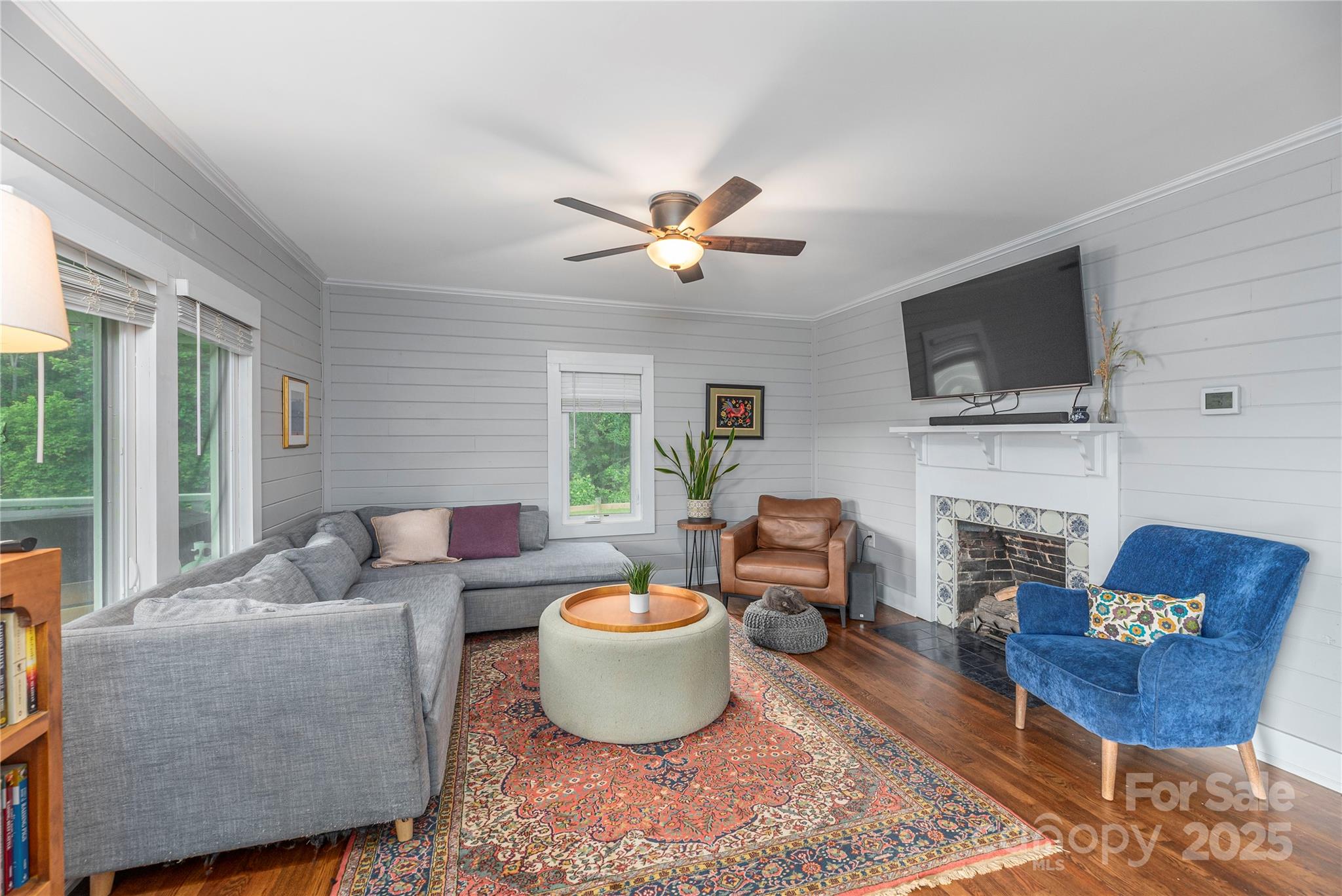 1304 Souther Road Old Fort, NC 28762 - Photo 12 of 48 a living room with furniture a fireplace and a flat screen tv