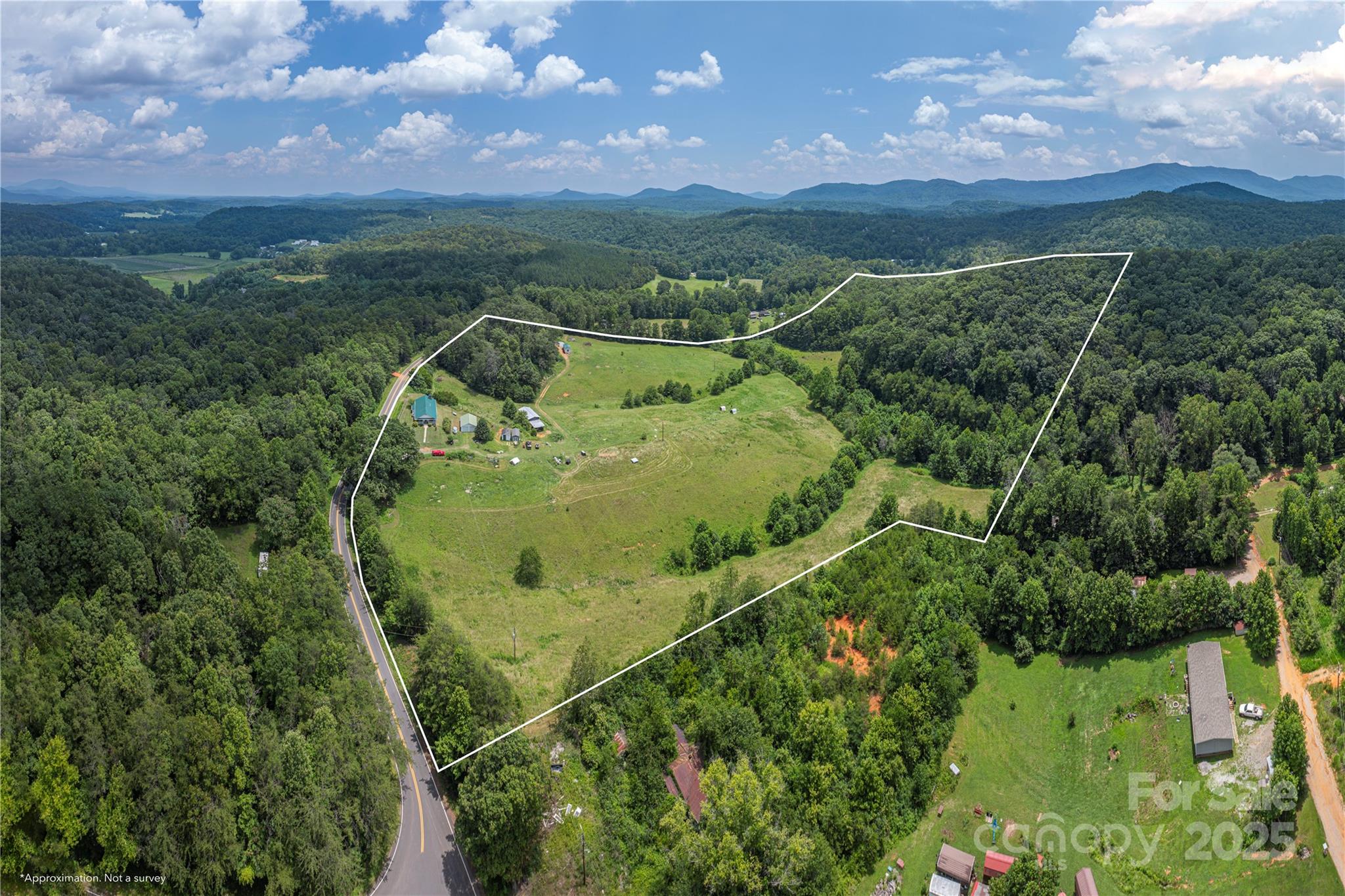 1304 Souther Road Old Fort, NC 28762 - Photo 2 of 48 a view of a garden with a building in the background