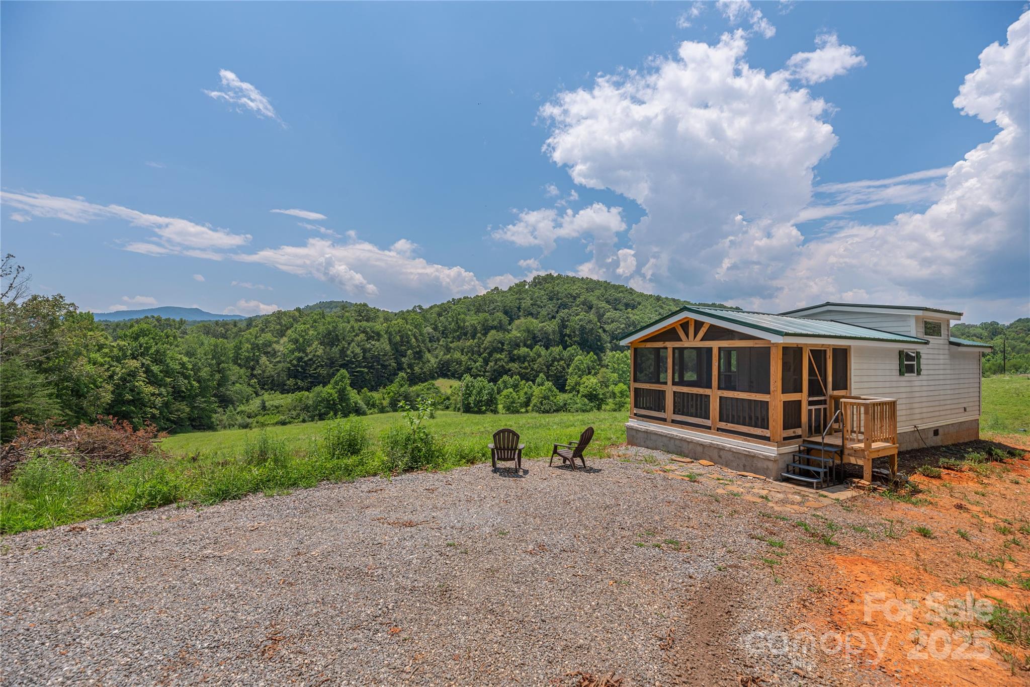 1304 Souther Road Old Fort, NC 28762 - Photo 34 of 48 a view of a house with a yard