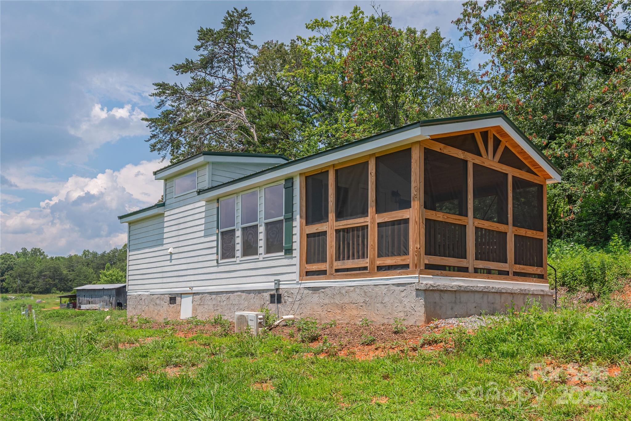 1304 Souther Road Old Fort, NC 28762 - Photo 35 of 48 a front view of a house with a yard
