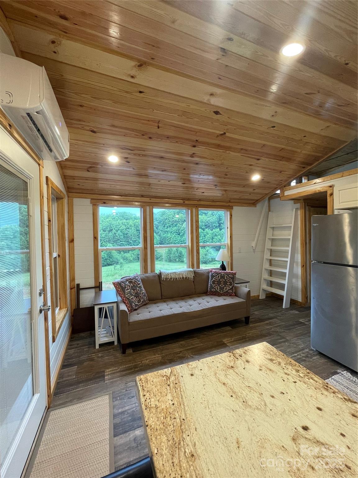 1304 Souther Road Old Fort, NC 28762 - Photo 36 of 48 a living room with furniture window and wooden floor