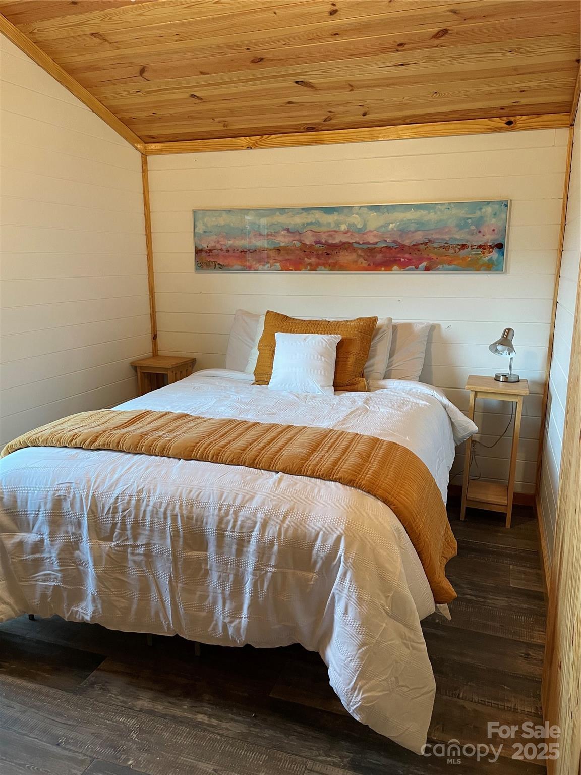 1304 Souther Road Old Fort, NC 28762 - Photo 39 of 48 a bed sitting in a bedroom next to a cabinet