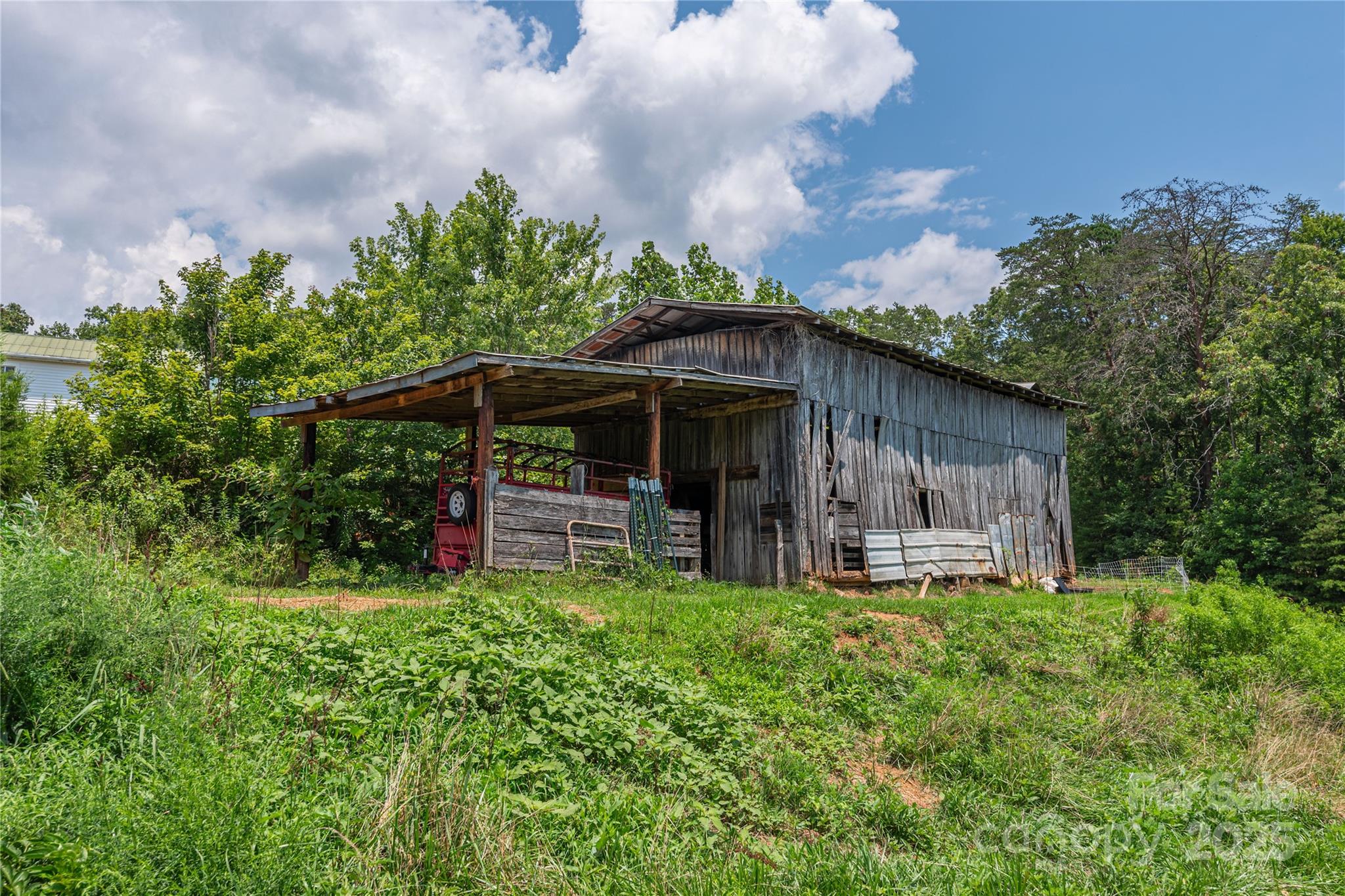 1304 Souther Road Old Fort, NC 28762 - Photo 7 of 48 a view of a house with a yard and sitting area