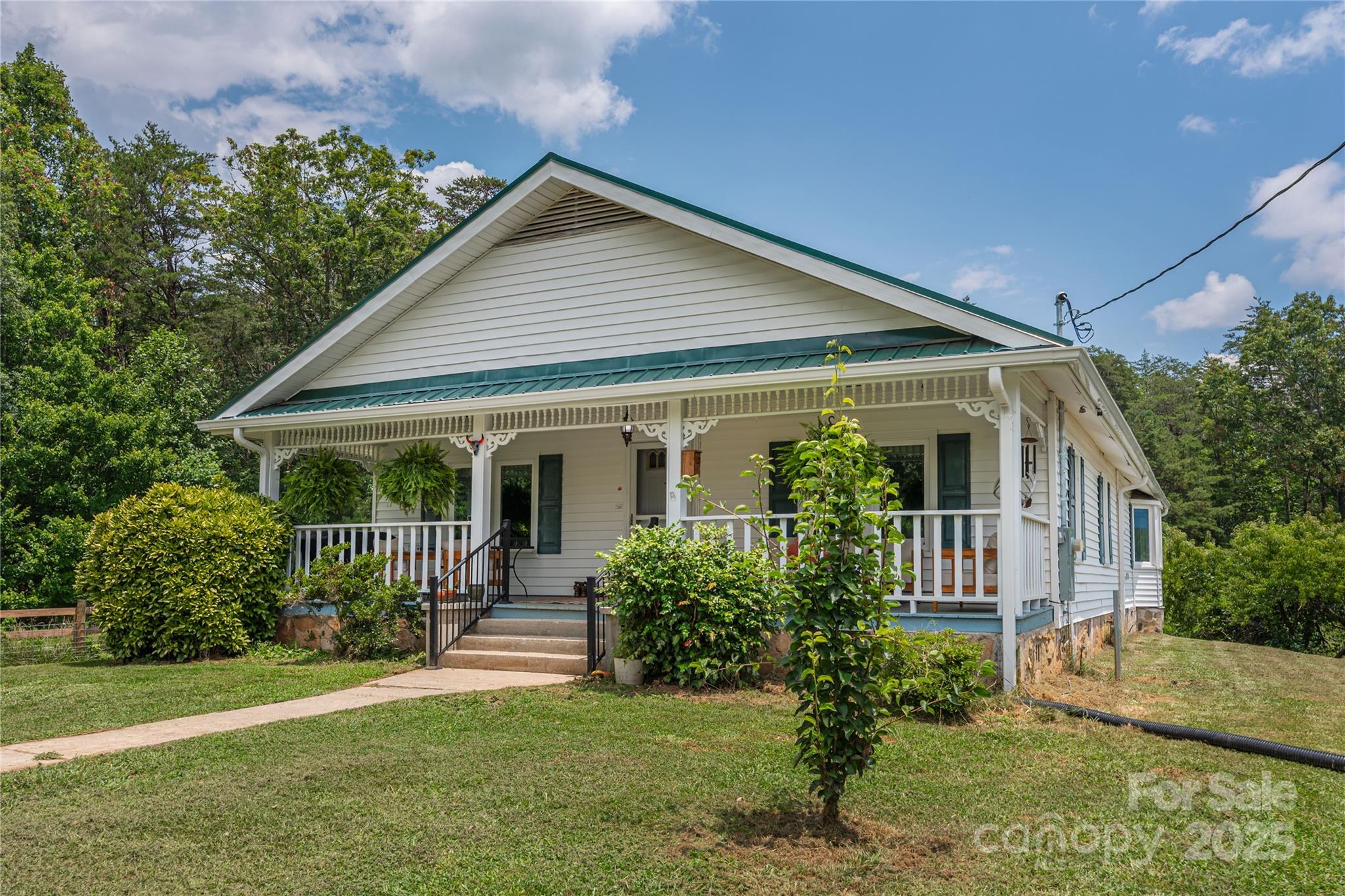 1304 Souther Road Old Fort, NC 28762 - Photo 8 of 48 a front view of house with a garden