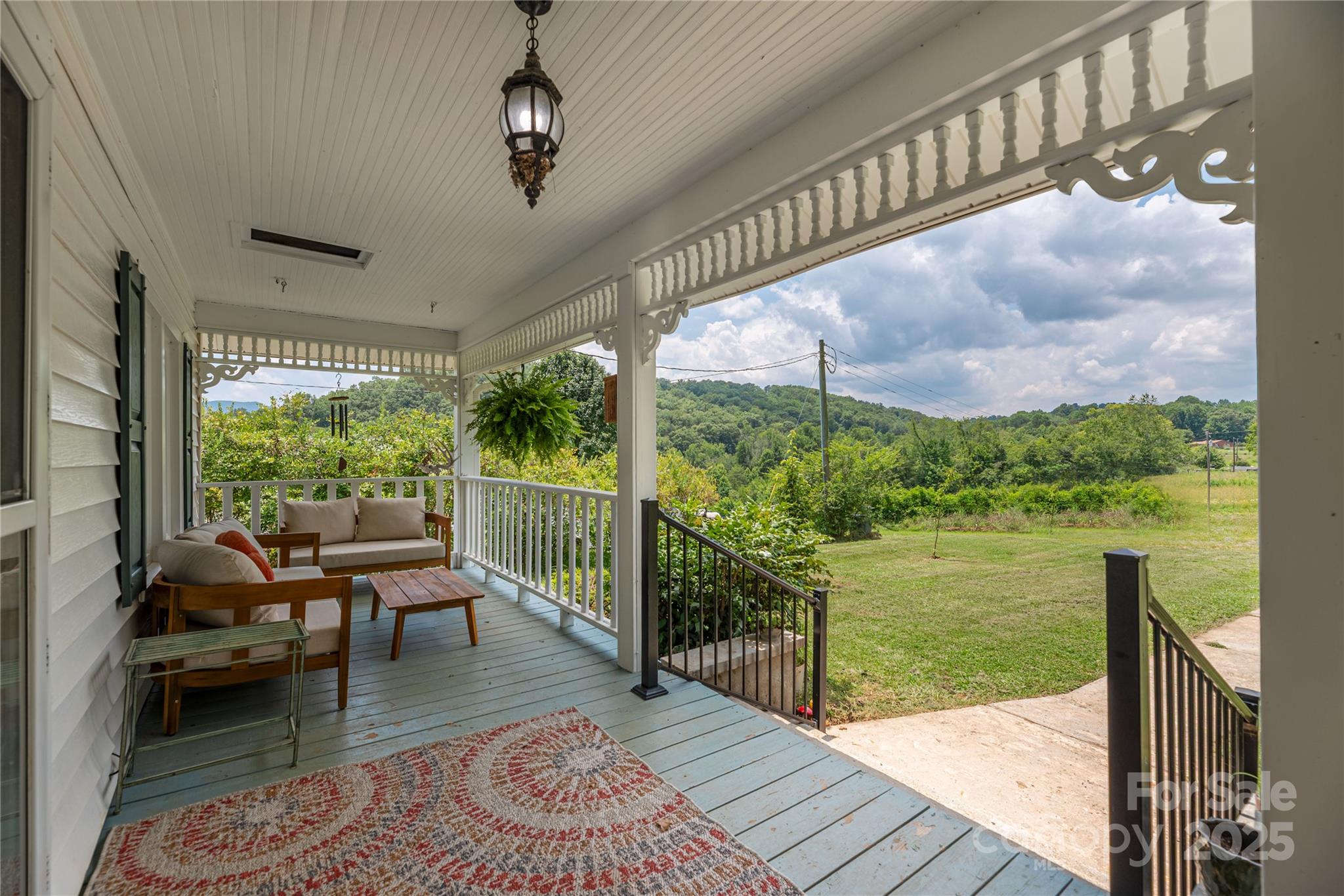 1304 Souther Road Old Fort, NC 28762 - Photo 9 of 48 a balcony with wooden floor and outdoor seating
