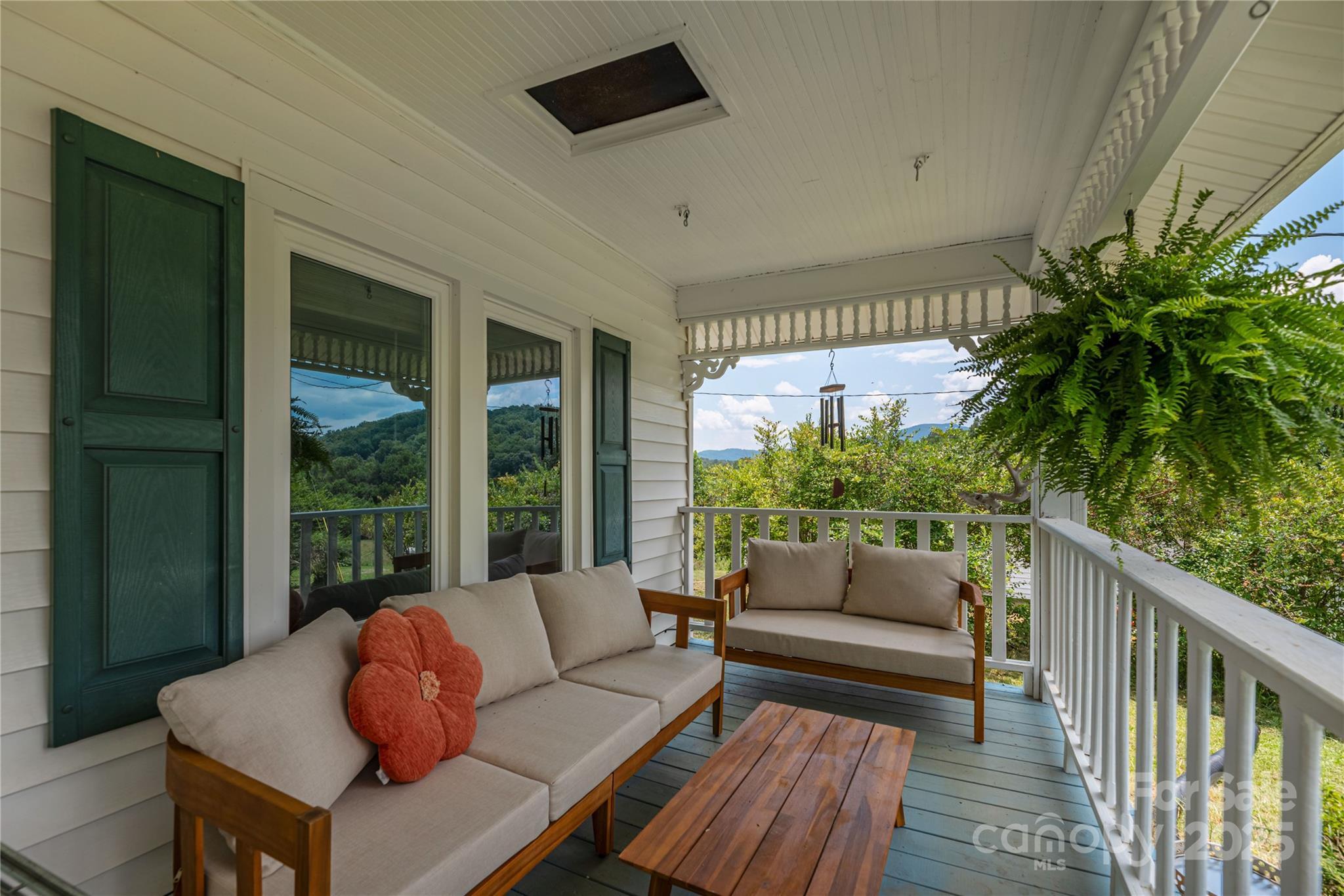 1304 Souther Road Old Fort, NC 28762 - Photo 10 of 48 a outdoor living space with furniture and a potted plant