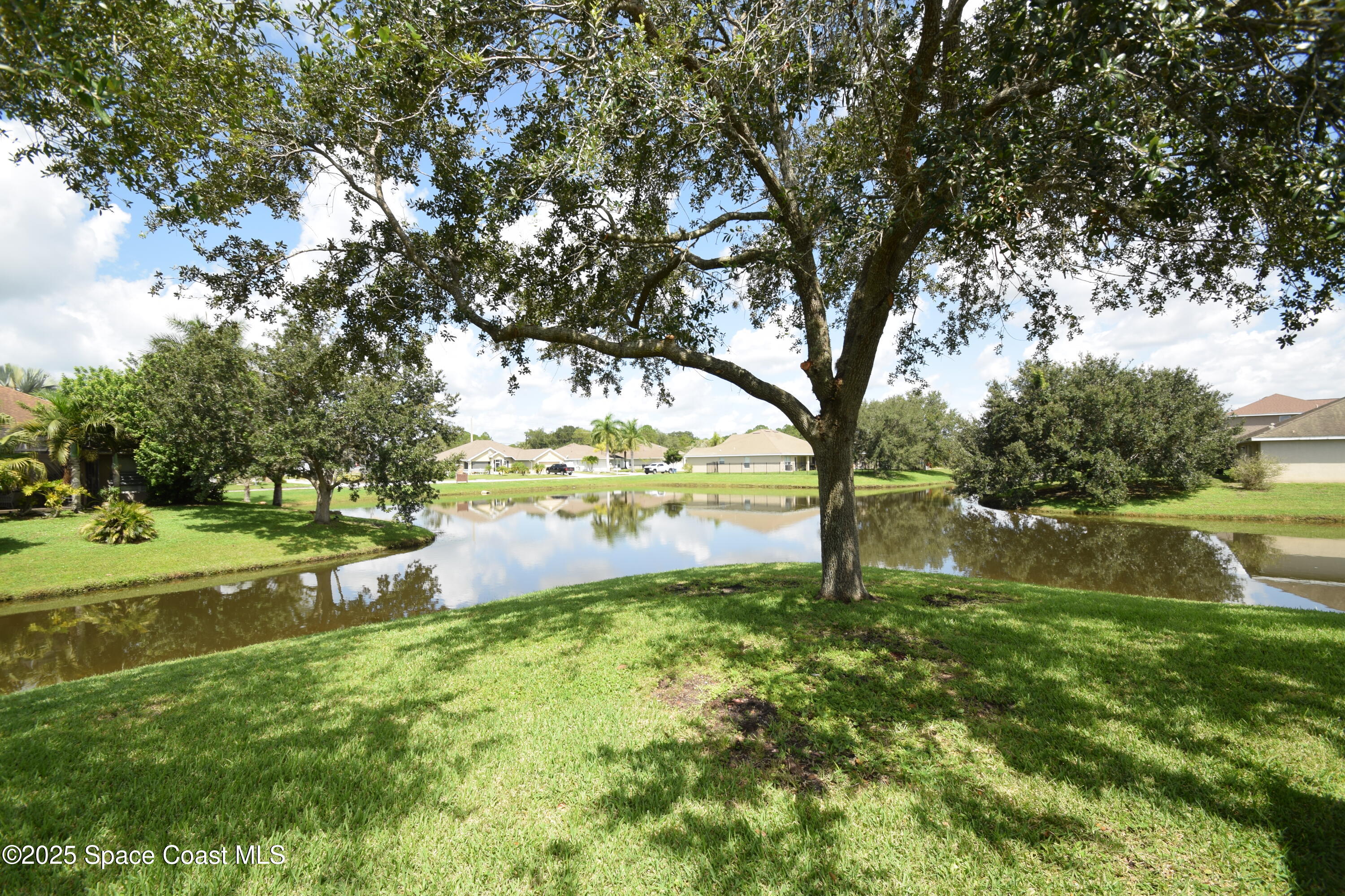 396 Pasto Circle Southwest Palm Bay, FL 32908 - Photo 4 of 75 View of serene lake