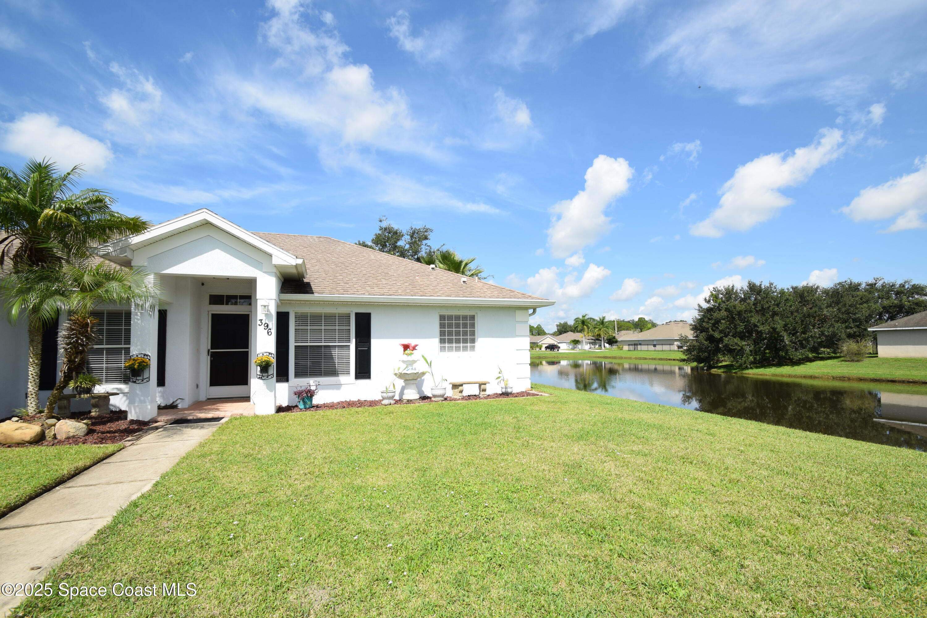 396 Pasto Circle Southwest Palm Bay, FL 32908 - Photo 6 of 75 Side and back lake views