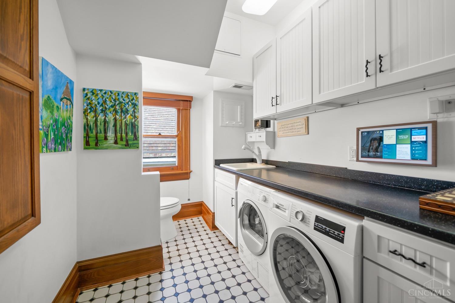 1945 Madison Road Cincinnati, OH 45206 - Photo 60 of 77 Laundry room on second floor with half bath attached.