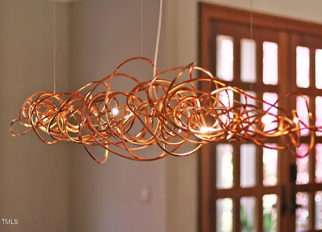 a large kitchen with kitchen island granite countertop a large counter top and stainless steel appliances