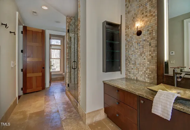 a view of closet with wooden floor