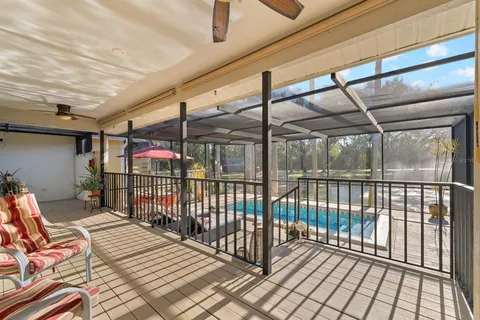 a view of a chairs and table in the balcony