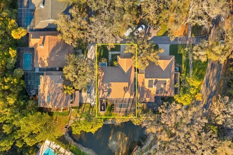 an aerial view of a house with a yard