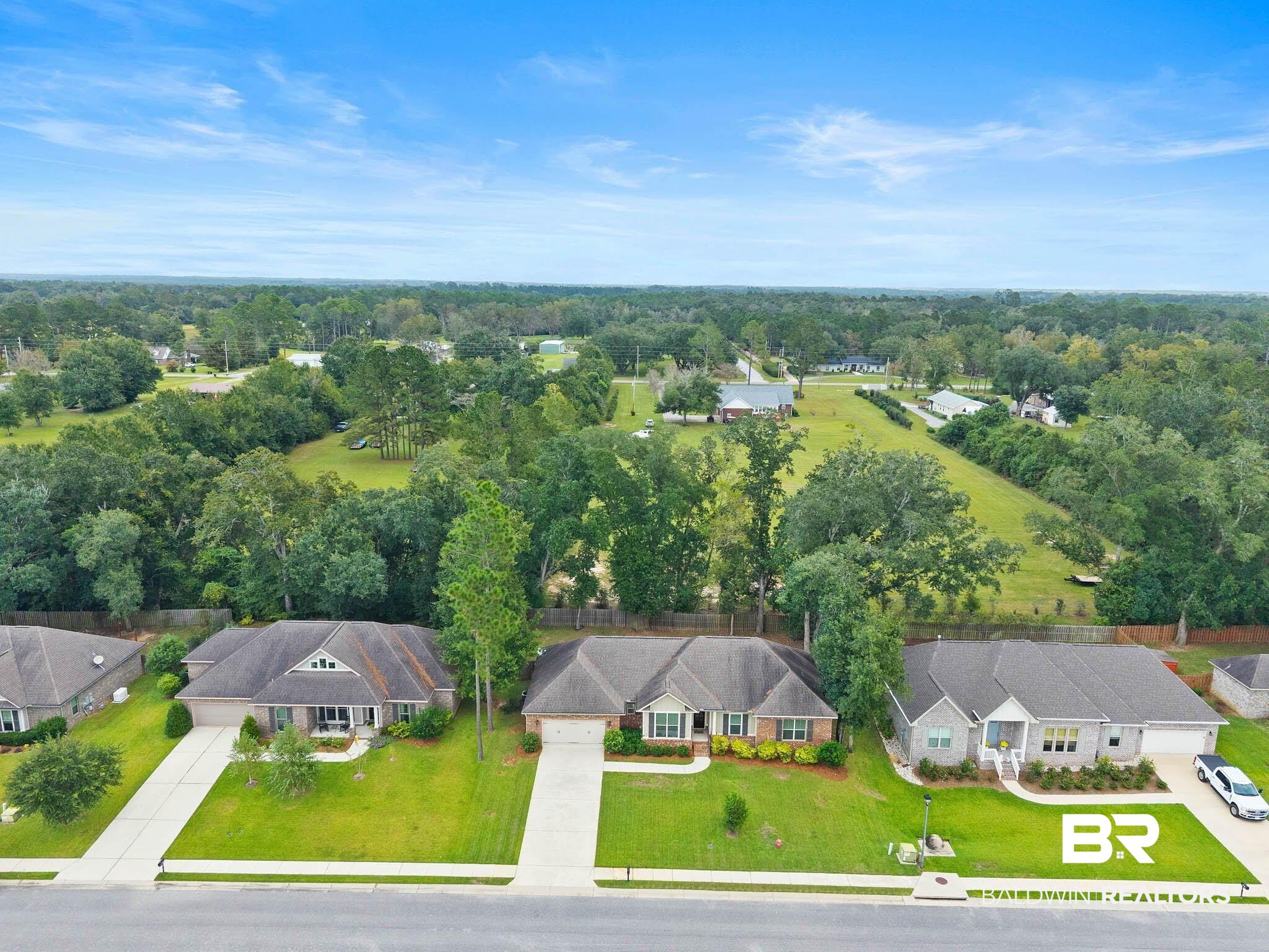 19740 Bunker Loop Fairhope, AL 36532 - Photo 33 of 33 Aerial perspective of suburban area featuring a heavily wooded area