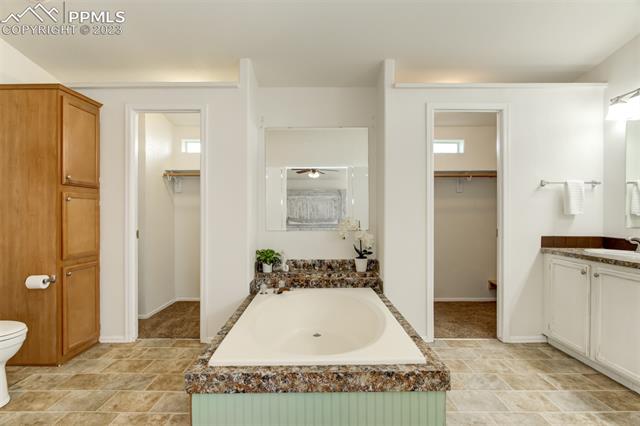 16215 Stage Stop Road Peyton, CO 80831 - Photo 6 of 33 Master Bath with Dual Walk-Ins